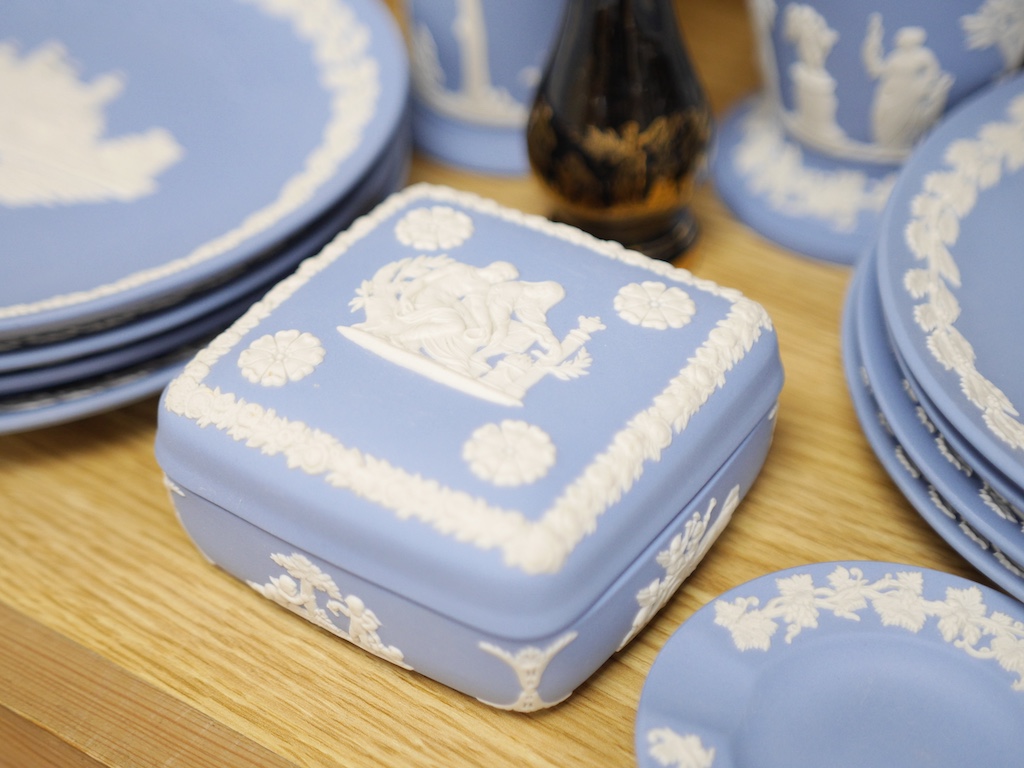Group of Wedgwood jasper ware to include a pair of vases and a set of eight Christmas plates, largest 21cm in diameter. Condition - good